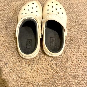 Worn crocs with fleece inside.  Size 8 women